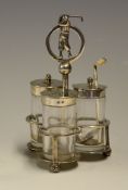 A fine silver golfing cruet stand c1914  - The trefoil form three division stand with handle in