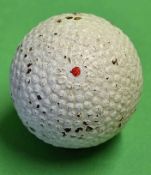 The Hopper bramble patent gutty golf ball retaining most of its original white paint, with a central