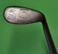 The Elite "Baxspin" concave face mashie niblick - with hyphen and dot face markings c/w the period