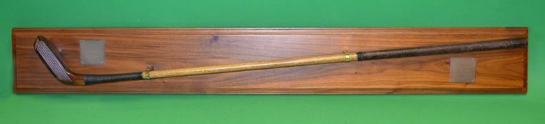 A Macleod beech wood replica longnose putter mounted on a presentation teak display board c/w