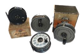 REELS: (4) Collection of 4 JW Young alloy fly reels, a Beaudex 4" medium width salmon reel, grey