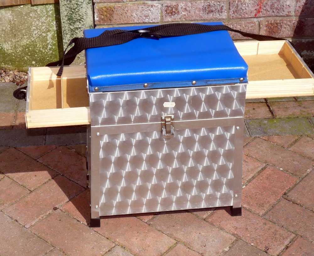 SEAT BOX: Alloy and wood continental seat box with padded seat, twin sliding drawers, hinged large