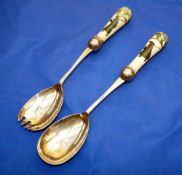 PORCELAIN: Pair of Royal Doulton porcelain handled salad servers, each 10" overall, painted