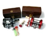 REELS: (2) Abu Sweden Ambassadeur 6000 red multiplier reel, grooved 4 screw end plate, white handle,