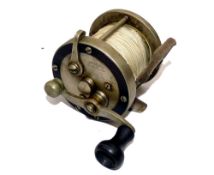 REEL: Pflueger Oceanic free spool surf casting reel, wood handle, leather thumb brake pad, ratchet