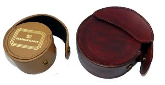 REEL CASES: (2) Hardy brown leather reel case, 4" OD, 2" ID, stud fastening flap, brown baize