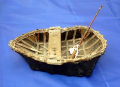 CORACLE: Miniature canvass tar covered coracle on wicker frame, built to replicate and original,