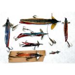 LURES: Collection of  7 leather swallow tail baits, a 7" example with celluloid fins, 5" Hardy