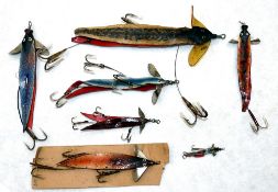 LURES: Collection of  7 leather swallow tail baits, a 7" example with celluloid fins, 5" Hardy