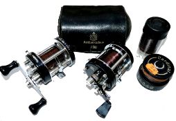 REELS: (2) Abu Sweden Ambassadeur  6000c black multiplier reel, 3 screw smooth end plate, foot stamp