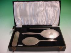 A Cased Silver Brush Set Engine turned, comprising hair brush, clothes brush, comb and mirror.