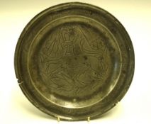 An English Pewter Dish With cast rim, the well decorated in wrigglework with a crowned lion (