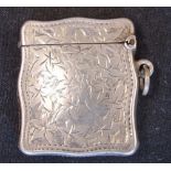 A Silver Vesta Case Of shaped form and engraved with leaves and initials to a cartouche. 1 ¼"