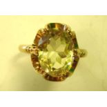 A Citrine Dress Ring The large stone in an openwork setting. In gold marked 375. Condition report:
