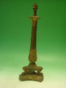 A Gilt Bronze Table Lamp The acanthus moulded reeded column raised on three paw feet and
