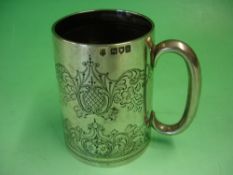 A Silver Mug Foliate engraved and inscribed "From Uncle Alec, South Africa, In Remembrance of God'