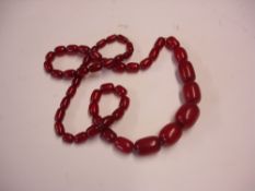 An Amber Necklace. Strung with graduated beads. 92g. Condition report: All good