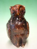 A Slip Glazed Stoneware Owl The glaze in shades of dark to light brown with traces of greenish