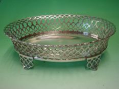 A Portuguese Silver Basket Of oval form with flared reticulated sides, raised on conforming shaped