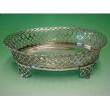 A Portuguese Silver Basket Of oval form with flared reticulated sides, raised on conforming shaped