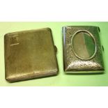 Two Silver Cigarette Cases One of curved form with removable frame for a photograph, the other