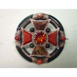 A Late Victorian Scottish Hardstone Brooch in silver with a Celtic cross motif mounted in a hoop and