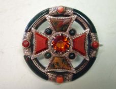 A Late Victorian Scottish Hardstone Brooch in silver with a Celtic cross motif mounted in a hoop and