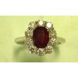 A Ruby and Diamond Cluster ring with a Burmese centre stone weighing approximately 1.67cts and ten