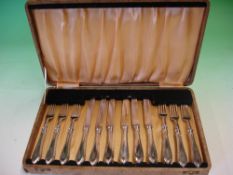 Cased Silver Dessert Set Comprising six knives and six forks. Continental. Bears registration mark