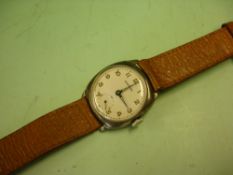 A Garrard Gentleman's Wristwatch Cushion silver Dennison case numbered 750426, the dial with