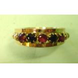 A Sapphire and Ruby Ring Set with three rubies and two sapphires. In gold. Condition report: All