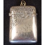 A Silver Vesta Case Of cushion form, engraved with foliage and initials RJW. 2" high. Birmingham