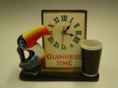 Advertising A Guinness mantel clock in typical form of a toucan and Guinness pint. 8 ½" high.
