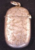 A Silver Vesta Case Of oval form and engraved with leaves, a vacant cartouche to one side. 1 5/8"