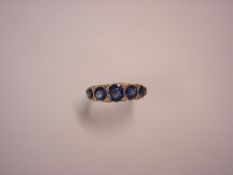 An Edwardian Sapphire and Diamond Ring Set with five graduated Ceylon sapphires and eight