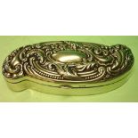 A Silver Snuffbox Of shaped form, the lid embossed with scrolling foliage around a vacant cartouche.