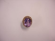 A Dress Ring Set with a large amethyst. In 9ct gold. Stone 19mm high. Condition report: Hoop