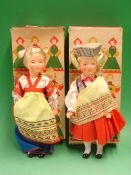 A Pair of Russian Dolls Plastic bodies and heads, c1960s, boxed. 11" high. Condition report: Good