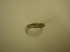 A Diamond Eternity Ring With channel set stones. In 18ct gold. Condition report: All good