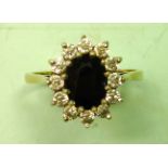 A Sapphire and Zircon Ring In a cluster setting. In gold marked 375. Condition report: All good