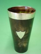 An Edwardian Horn Beaker With silver mounted rim and applied vacant shield cartouche. 5 ¾" high.