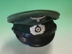 A Third Reich Period Army NCOs Peaked Hat Maker Hermann Rudebusch marked to cellued diamond. Green
