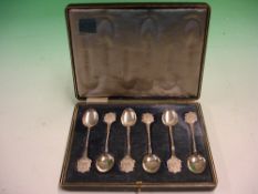 A Cased Set of Silver Teaspoons With armorial terminals and twisted shafts. Birmingham 1911.