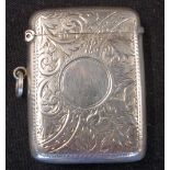 A Silver Vesta Case Engraved with scrolling foliage, a vacant cartouche to one side. 2" high.