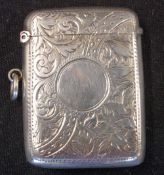 A Silver Vesta Case Engraved with scrolling foliage, a vacant cartouche to one side. 2" high.