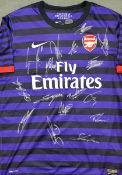 Signed 2013 Arsenal away football shirt a child replica signed by the team such as, Arteta, Cazorla,