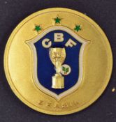 Presentation medal from Brazil, to the obverse is an enamel inset depicting the World Cup Trophy