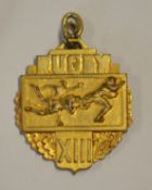 Interesting Rugby League yellow metal medal - embossed on the obverse with a rugby scene and