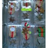 Selection of WWII Medals in a folder containing 39/45 Star, Pacific, Atlantic, War, Defence, France,