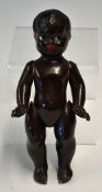 Composite black Doll having moving hands and arms with painted eyes and lips 8 inches high